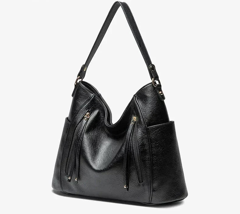 Borsa elegante marrone effetto pelle, con dettagli metallici. Accessorio moda che valorizza ogni look.