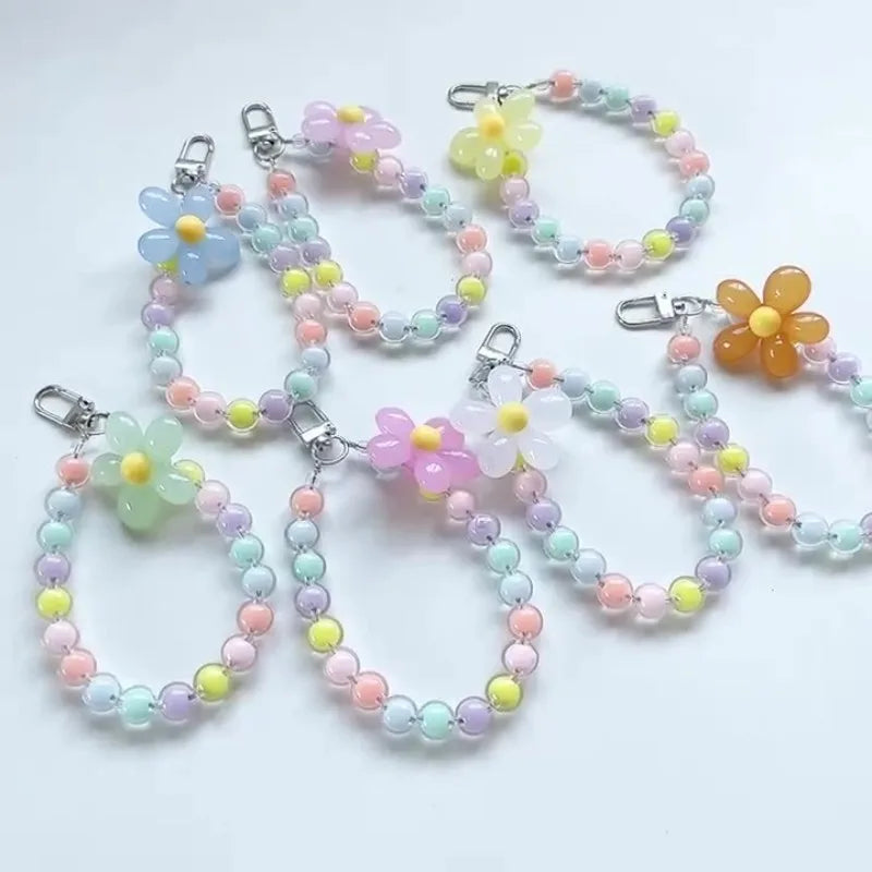 Laccetto telefono donna, design floreale con perline macaron colorate, pratico e alla moda, per te.