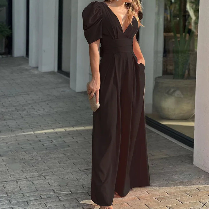 Tuta intera donna elegante, maniche a palloncino moderne e scollo a V, per un outfit da cerimonia raffinato.