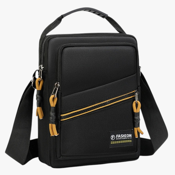 Borsa messenger uomo grigia, compatta in tessuto, ideale per viaggi e stile casual.