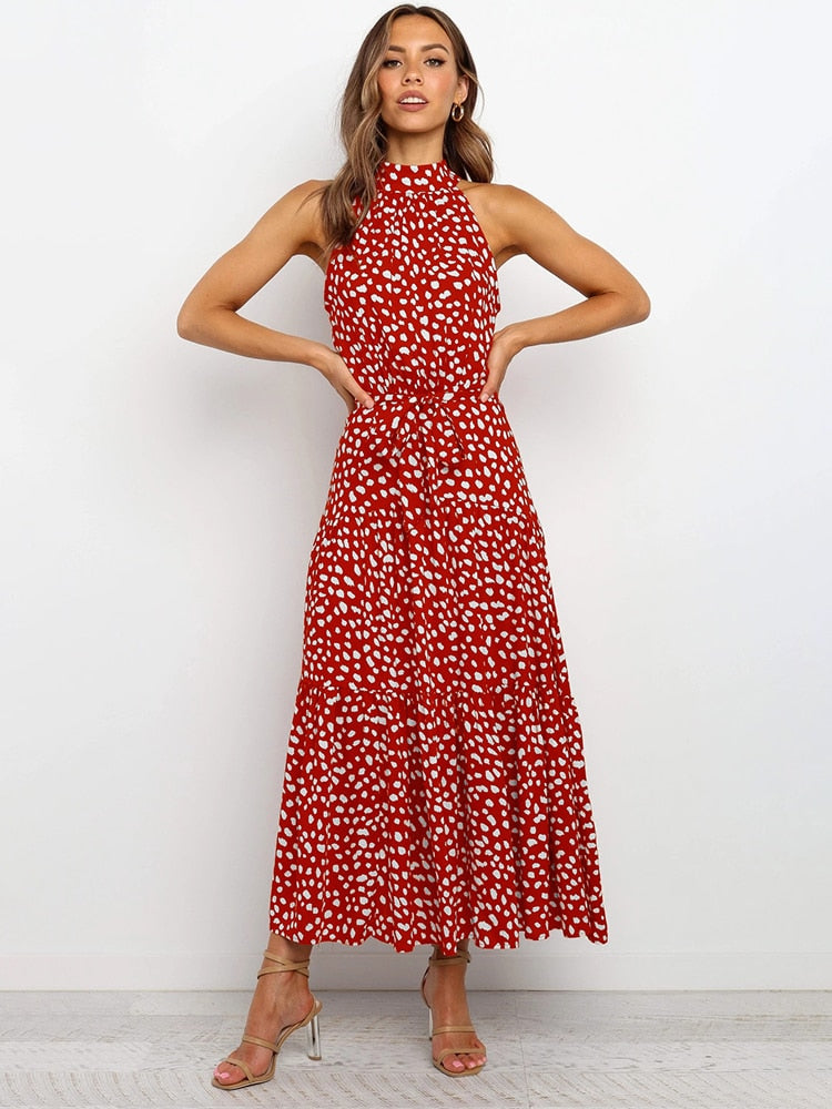 Abito midi donna a pois con cintura, ideale per un look casual chic o elegante estivo. Taglio svasato.