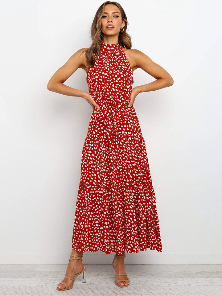 Abito midi donna a pois con cintura, ideale per un look casual chic o elegante estivo. Taglio svasato.