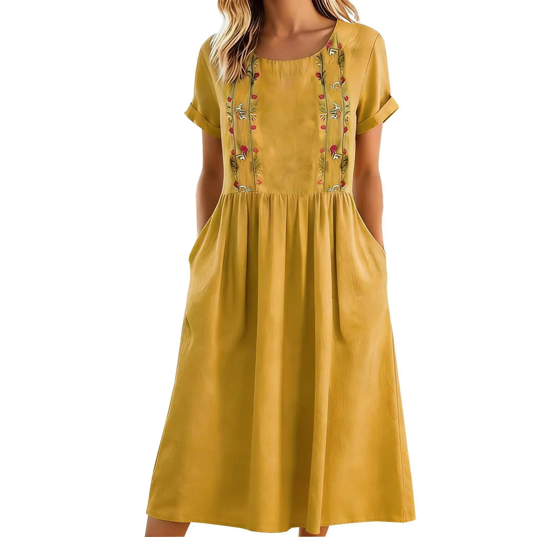 Vestito midi donna estivo, ricamo floreale, linea A, tasche. Perfetto per un look moda casual chic e confortevole.
