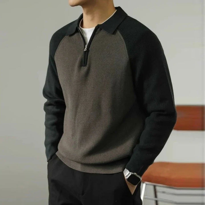 Maglione uomo elegante nero, mezza zip, colletto polo. Perfetto per outfit casual-business.
