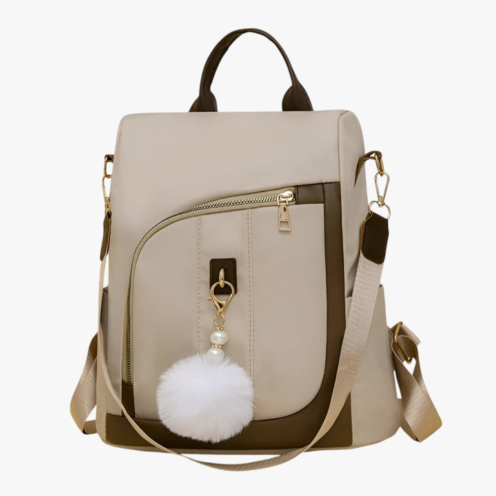 Borsa a zaino donna con pompon, accessorio moda versatile; zaino casual in colori beige o caffè.