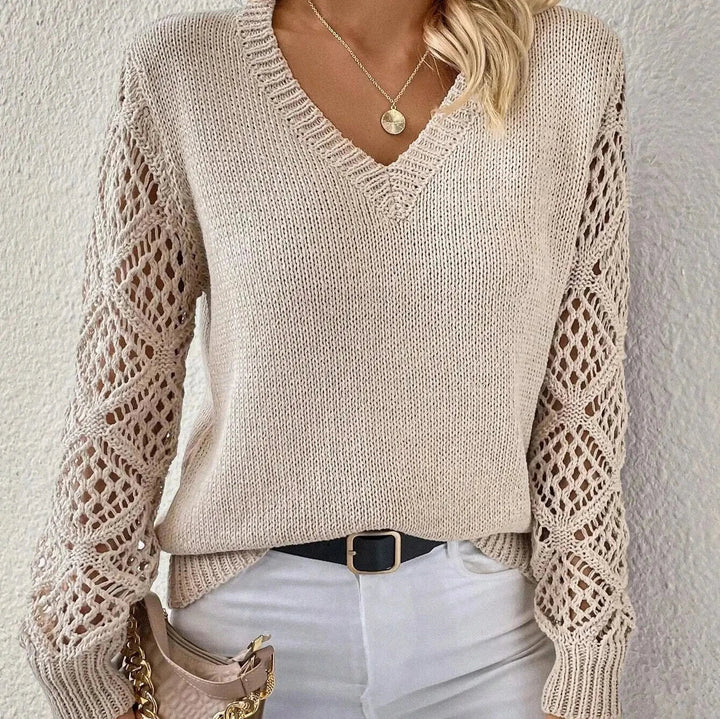 Maglione donna elegante con scollo a V, perfetto per look casual chic o raffinati in autunno inverno.