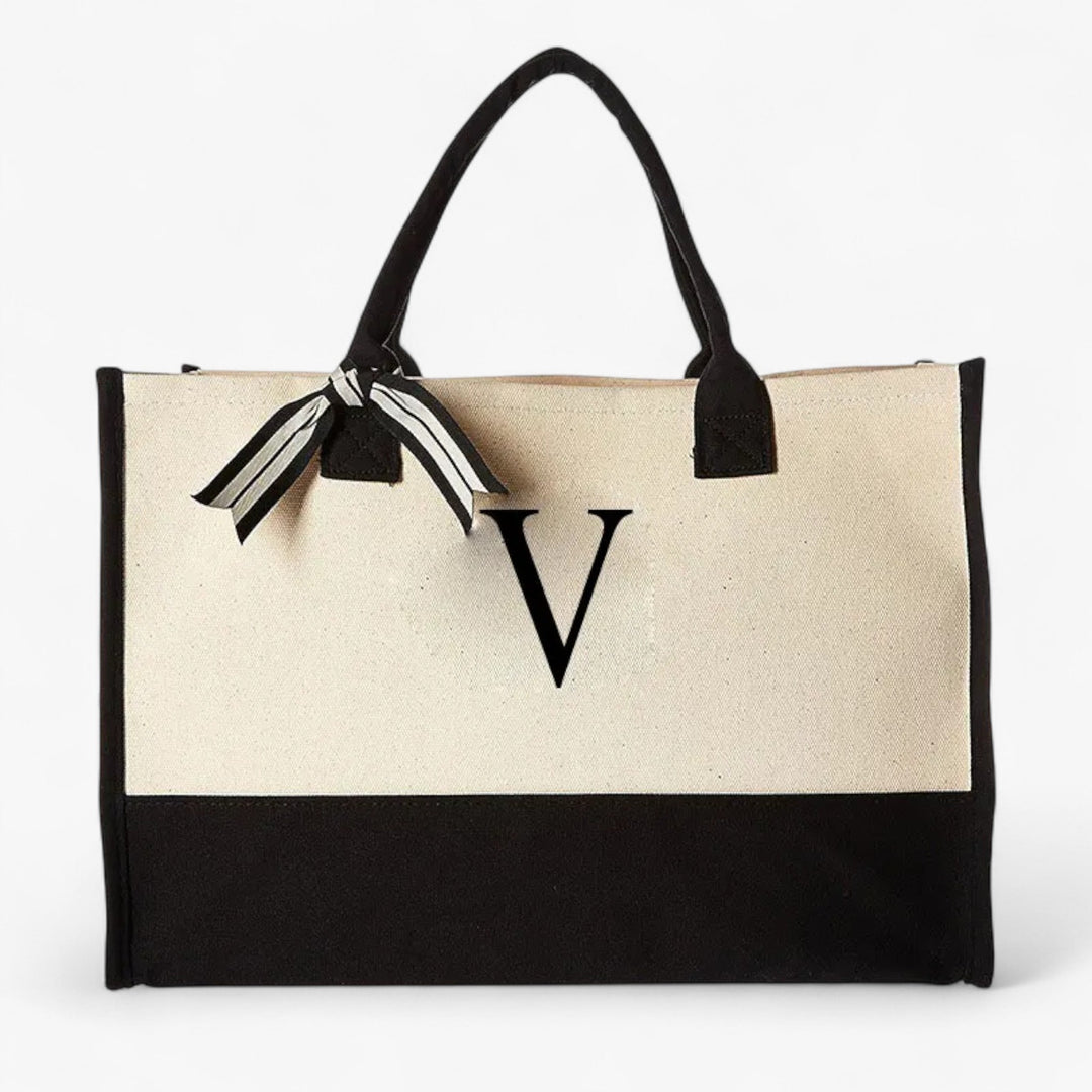 Borsa tote donna, beige e nera, con iniziale personalizzata. Accessorio grande e di stile per ogni giorno.