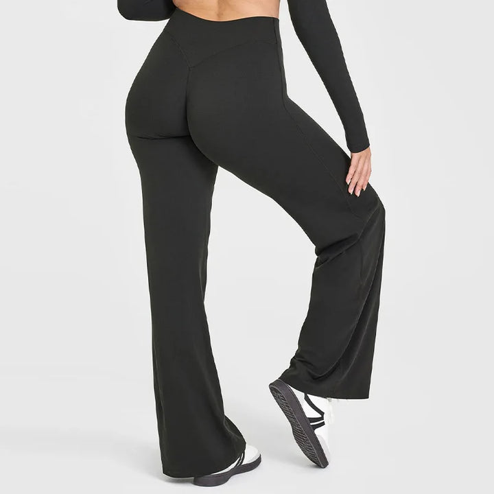 Pantaloni elasticizzati da donna, vita alta e gamba ampia, ottimi per yoga, meditazione e fitness.