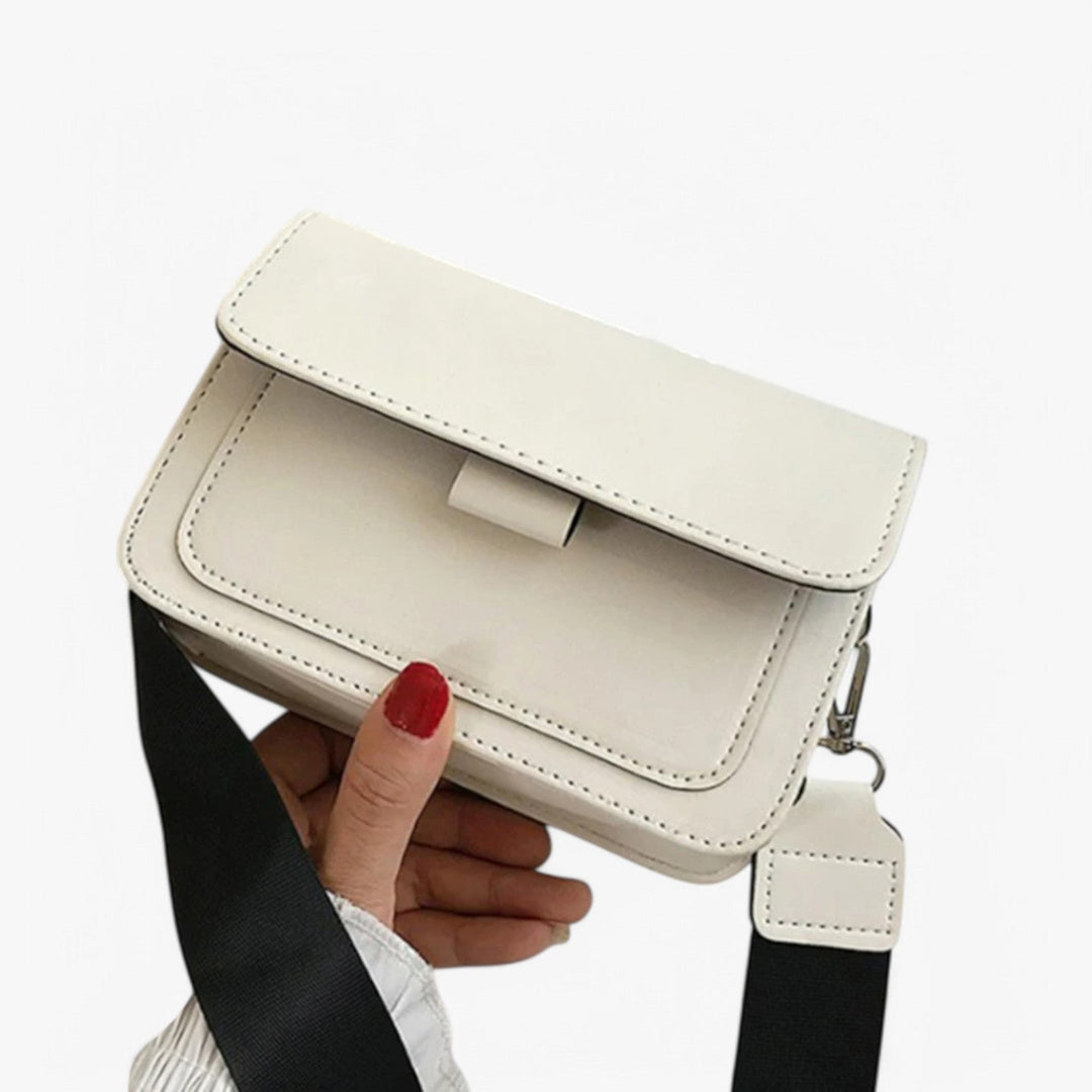 Borsa a tracolla donna con patta, design moderno e multicolore, accessorio moda versatile ed elegante.