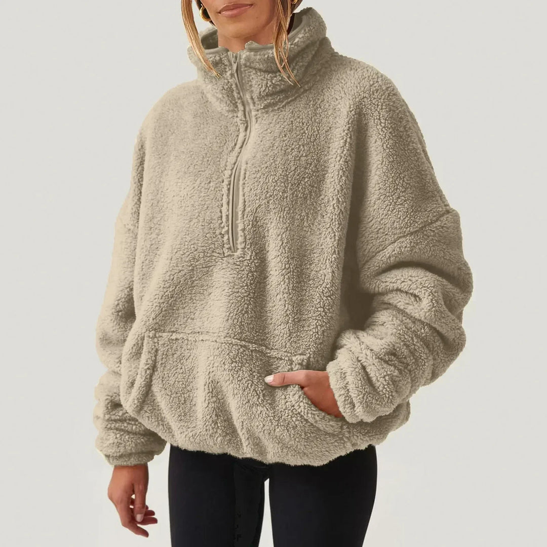 Maglieria donna comoda a maniche lunghe con colletto e mezza zip. Stile casual per il tuo guardaroba.