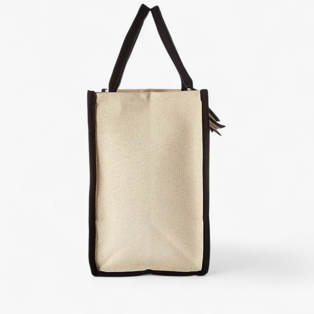 Accessorio donna: borsa tote beige e nera con iniziale personalizzabile. Stile unico e versatile.