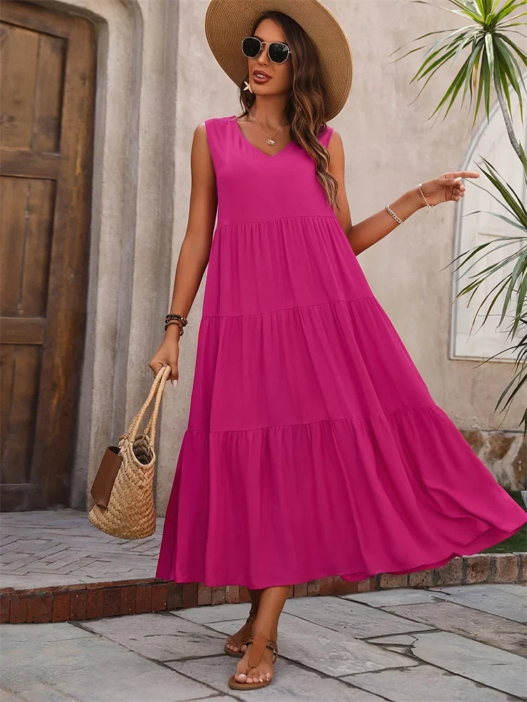 Abito lungo donna senza maniche, con balze. Stile estivo casual per la spiaggia o passeggiate.