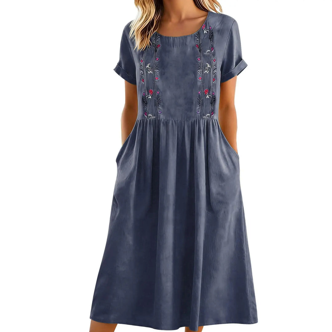 Elegante abito midi da donna a linea A con stampa floreale. Stile casual chic, con pratiche tasche laterali.