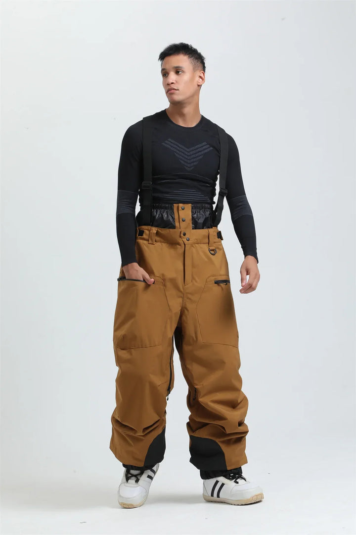 Pantaloni da neve unisex rossi, impermeabili e caldi, con bretelle per sci e snowboard estremo.