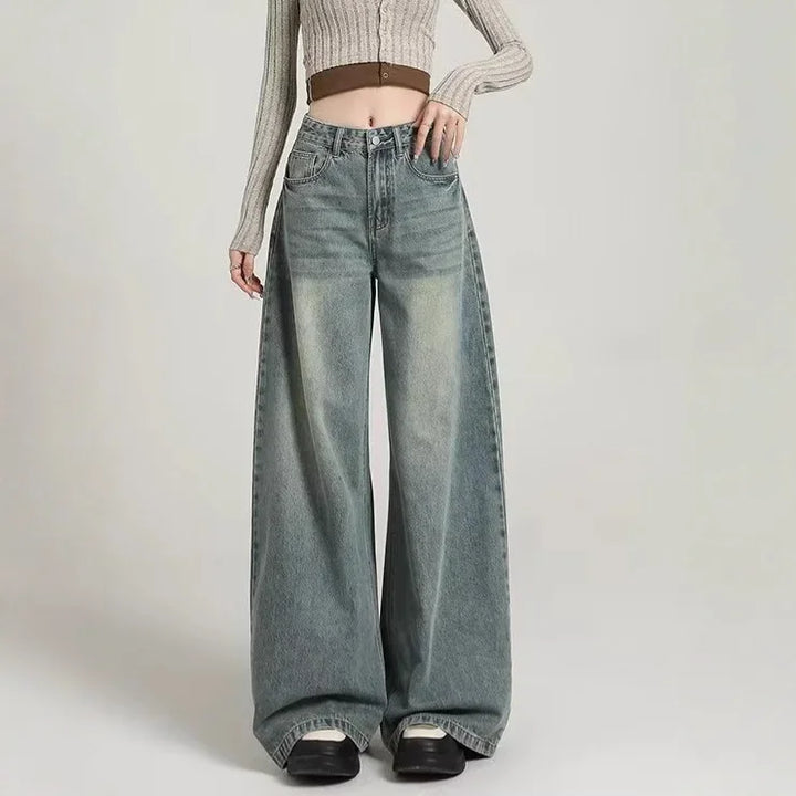Jeans baggy donna a vita alta grigi, pantaloni larghi e comodi per moda casual. Stile moderno e versatile.