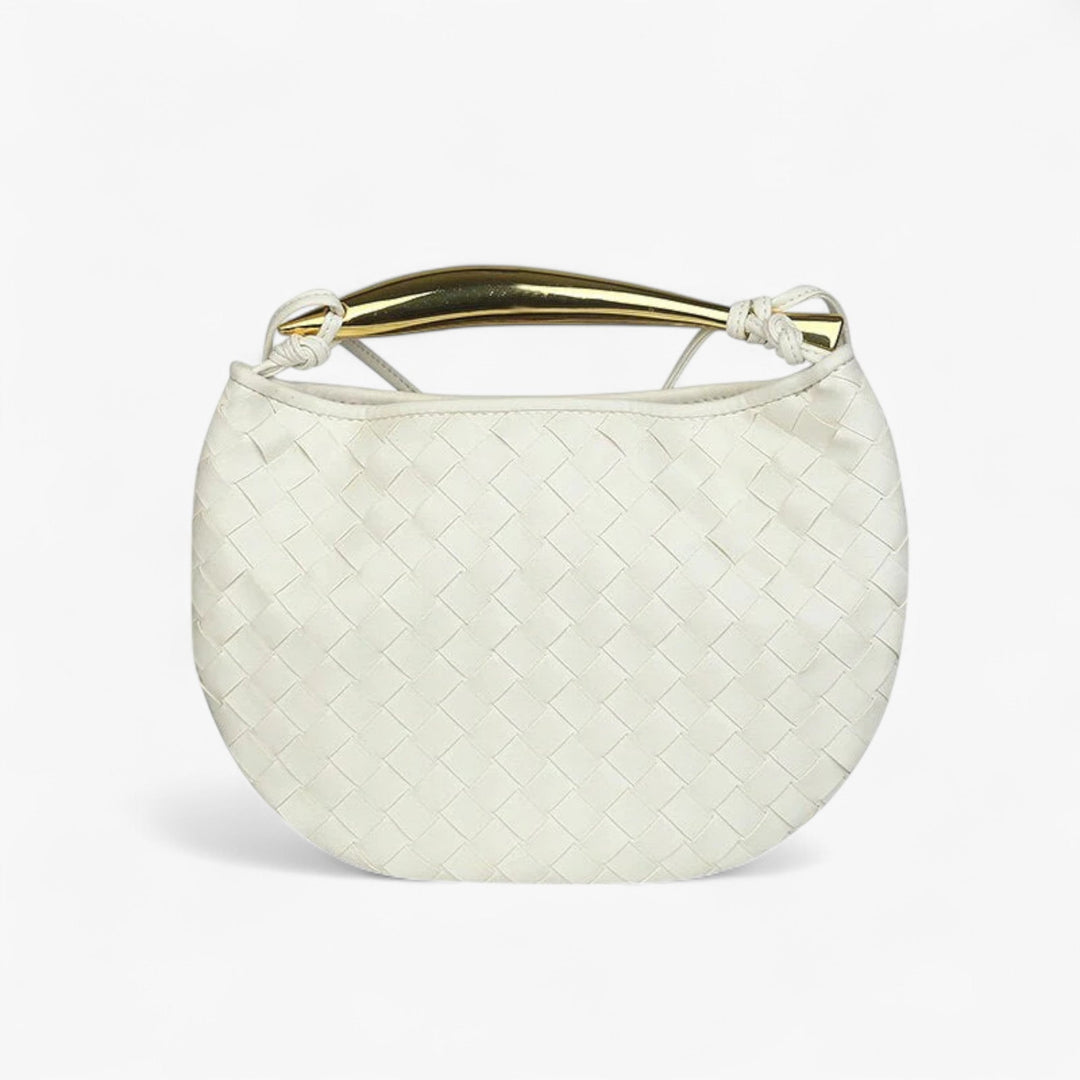 Accessorio moda: borsa a mano trapuntata con finiture eleganti. Indispensabile per la donna moderna.