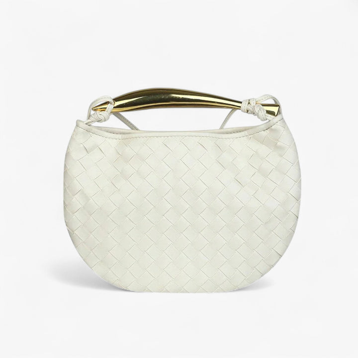Accessorio moda: borsa a mano trapuntata con finiture eleganti. Indispensabile per la donna moderna.