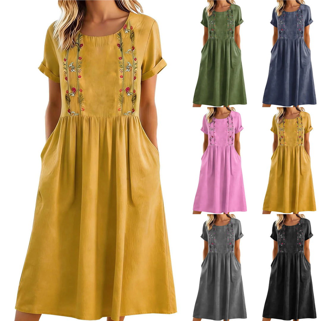 Vestito midi estivo da donna a linea A con comode tasche laterali e ricamo floreale. Stile casual chic.