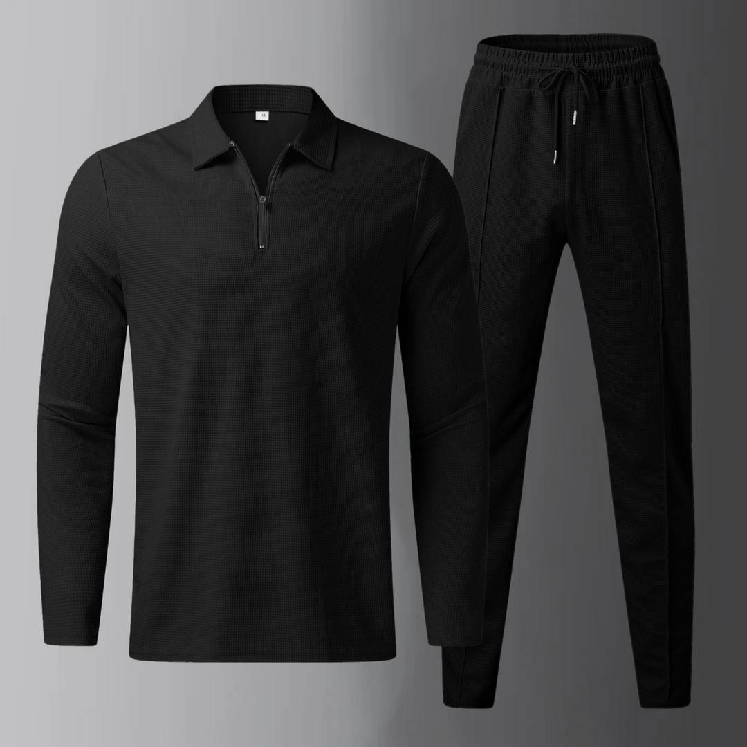 Set completo uomo nero, polo casual a maniche lunghe e jogger, ideale per viaggi e relax.
