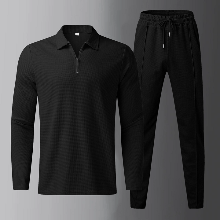 Set completo uomo nero, polo casual a maniche lunghe e jogger, ideale per viaggi e relax.