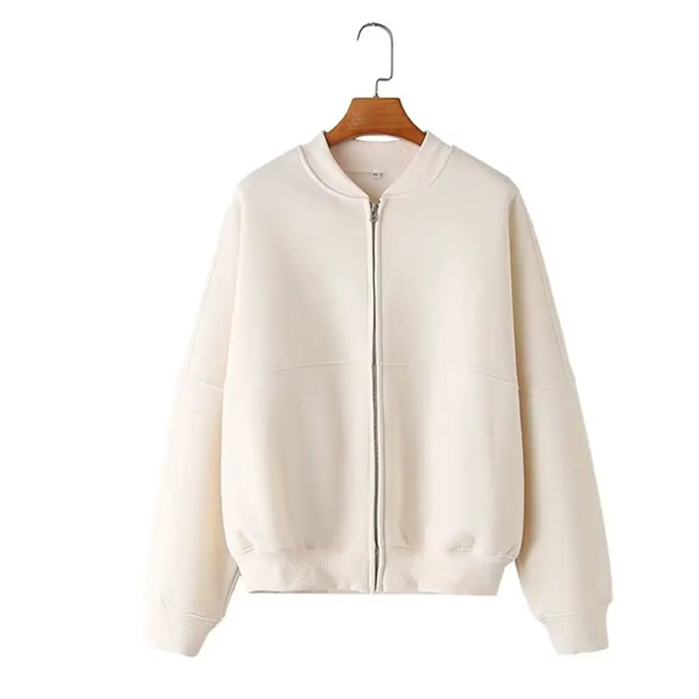 Completo donna due pezzi, un top a maniche lunghe con zip e pantaloni a gamba larga. Abbigliamento casual confortevole e chic.