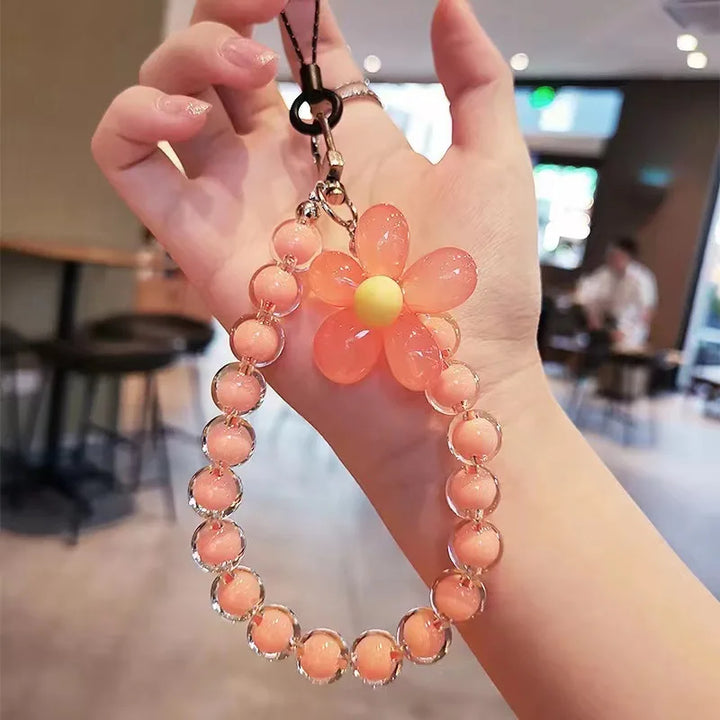 Perline macaron e fiore: laccetto telefono donna colorato, un accessorio vivace per il polso, che allegria!
