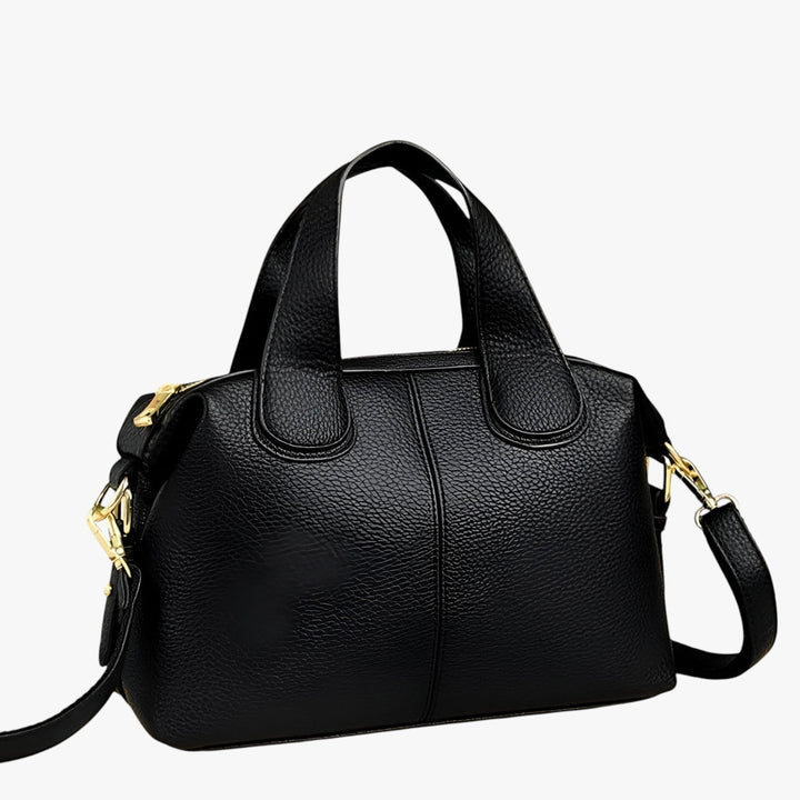 Elegante borsa a mano nera per donna, design compatto e moderno, perfetta per lo stile urbano.