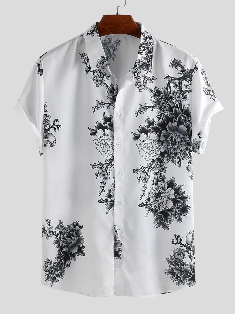 Elegante camicia estiva da uomo con stampa floreale vivace, maniche corte. Ideale per un look fresco e alla moda in ogni occasione.