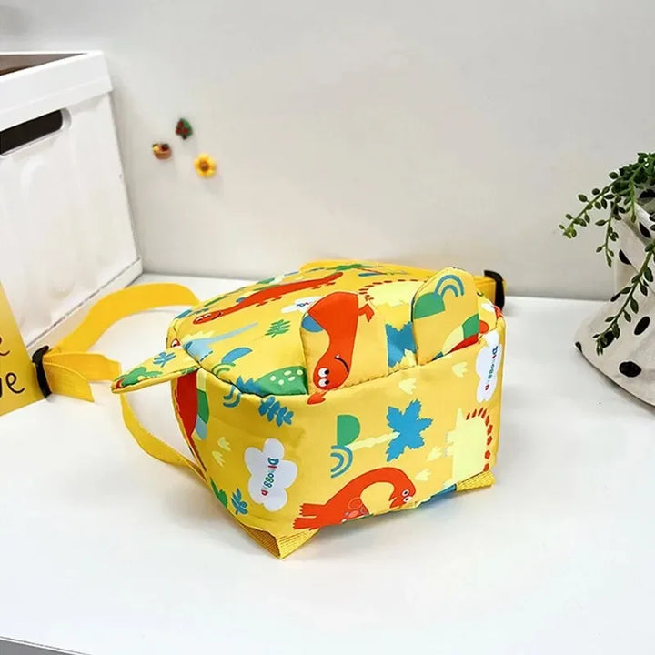 Zaino leggero dinosauro per asilo, perfetto per trasportare giochi e merenda dei bambini.