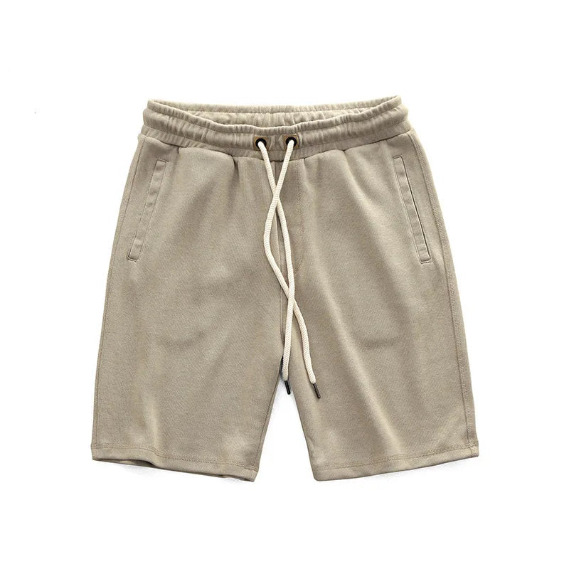 Pantaloncini sportivi uomo blu navy con vita regolabile e tasche laterali, ideali per fitness, sport e relax estivo.