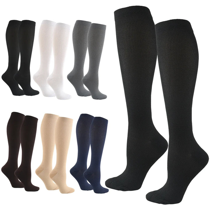 Calze compressive unisex per sport, viaggio e sollievo anti-fatica, offrono supporto e comfort.