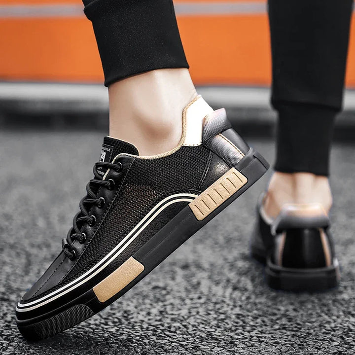 Sneakers uomo: scarpe casual bianche e nere, traspiranti. Comfort elevato e stile moderno per ogni occasione.