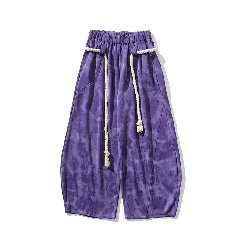 Pantaloni tuta uomo tie-dye gamba larga, modello casual con cordoncino per comfort e stile streetwear moderno.