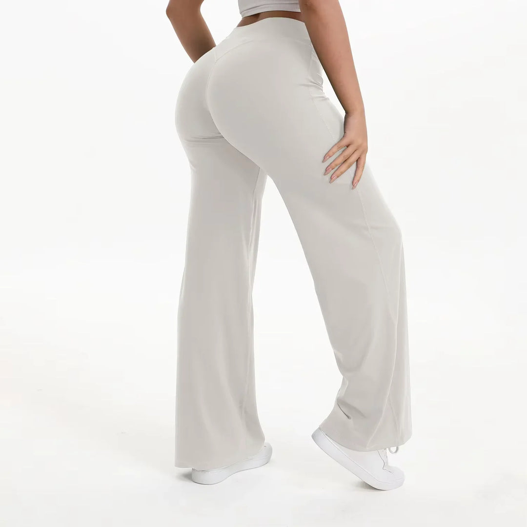 Pantaloni yoga neri donna, vita alta, gamba ampia, tessuto morbido e traspirante per ogni posa.