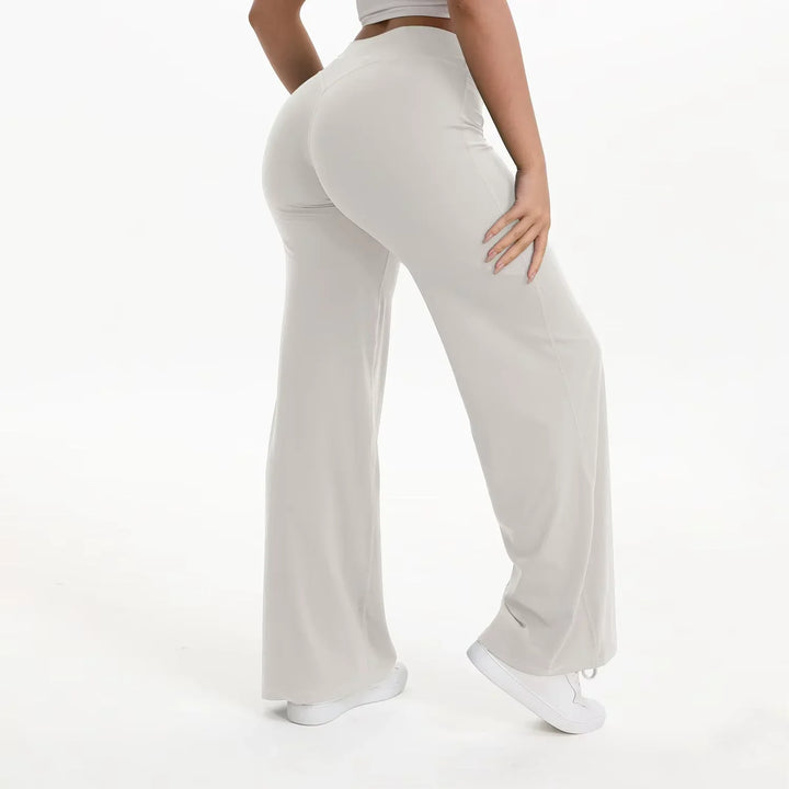 Pantaloni yoga neri donna, vita alta, gamba ampia, tessuto morbido e traspirante per ogni posa.