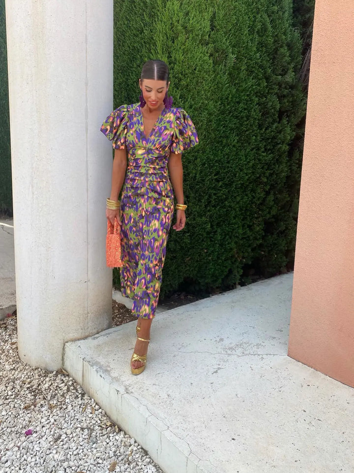 Abito donna elegante, scollo a V e maniche a sbuffo, ideale per la primavera e l'estate.