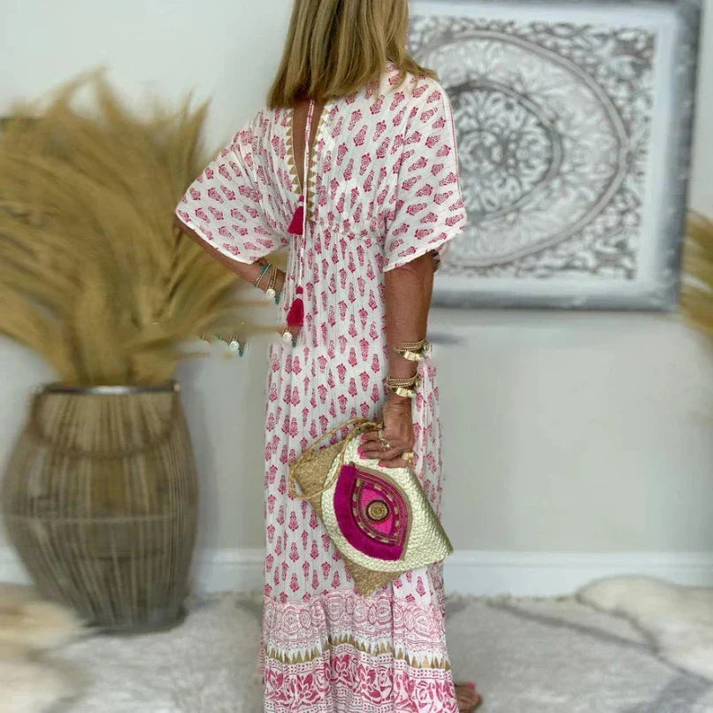 Abito estivo donna lungo, stile boho chic con stampa floreale e profondo scollo a V, comodo e casual.