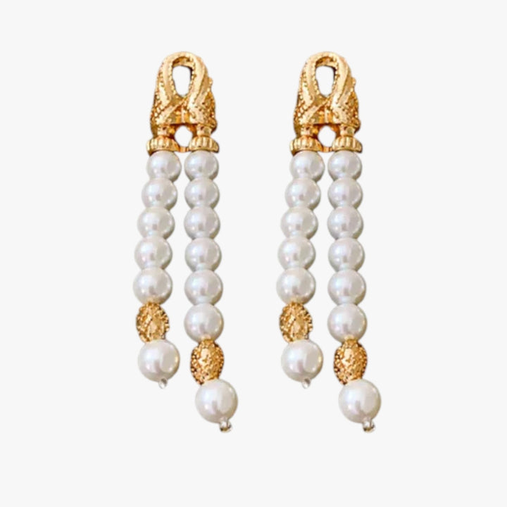 Orecchini pendenti donna in oro con elegante elemento sferico, gioielli moda versatili.