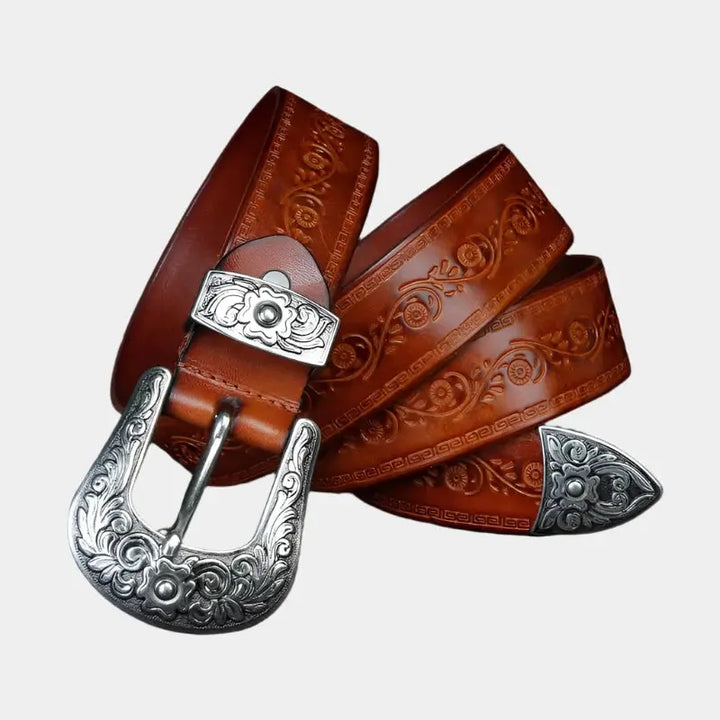 Cintura uomo vera pelle stile western con fibbia incisa dettagliata, ideale per look cowboy e casual.
