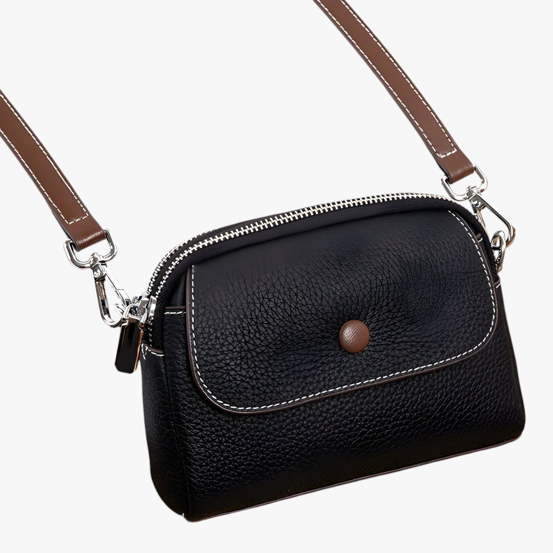 Borsa a tracolla da donna, compatta ed essenziale, perfetta per portare il necessario con stile.