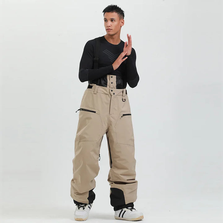 Pantaloni da sci unisex neri, impermeabili con bretelle, robusti per sport invernali e freddo estremo.