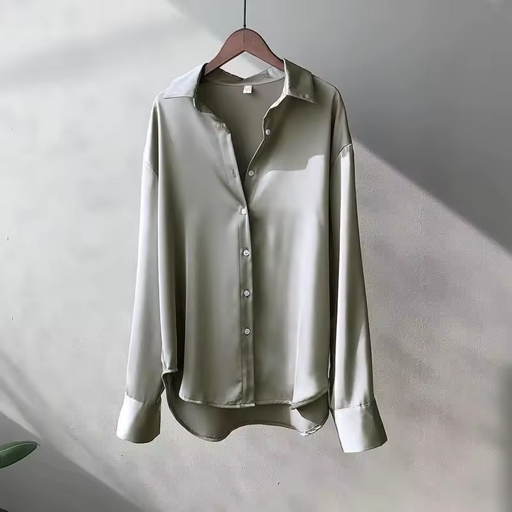 Blusa elegante e versatile donna in raso, con maniche lunghe e colletto, un must-have per la moda attuale.