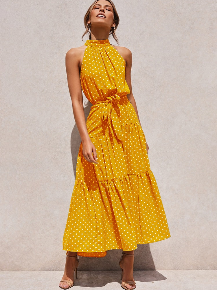 Abito estivo midi a pois per donna, svasato e con cintura. Garantisce comfort ed eleganza tutto il giorno.