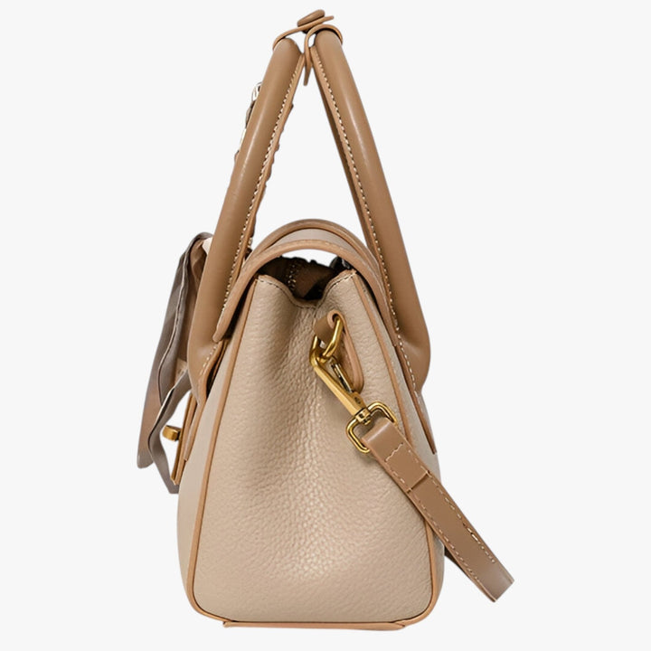 Borsa a mano da donna beige con foulard decorativo. Accessorio versatile per stile elegante e quotidiano.