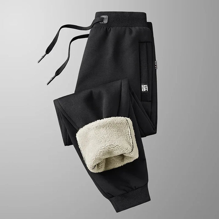 Pantaloni jogger uomo invernali grigi, caldi e confortevoli, con vita elasticizzata. Ideali per sport e casual.
