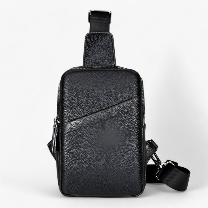 Borsa monospalla nera compatta unisex, pratica per viaggio e avventura. Tracolla regolabile per comfort.