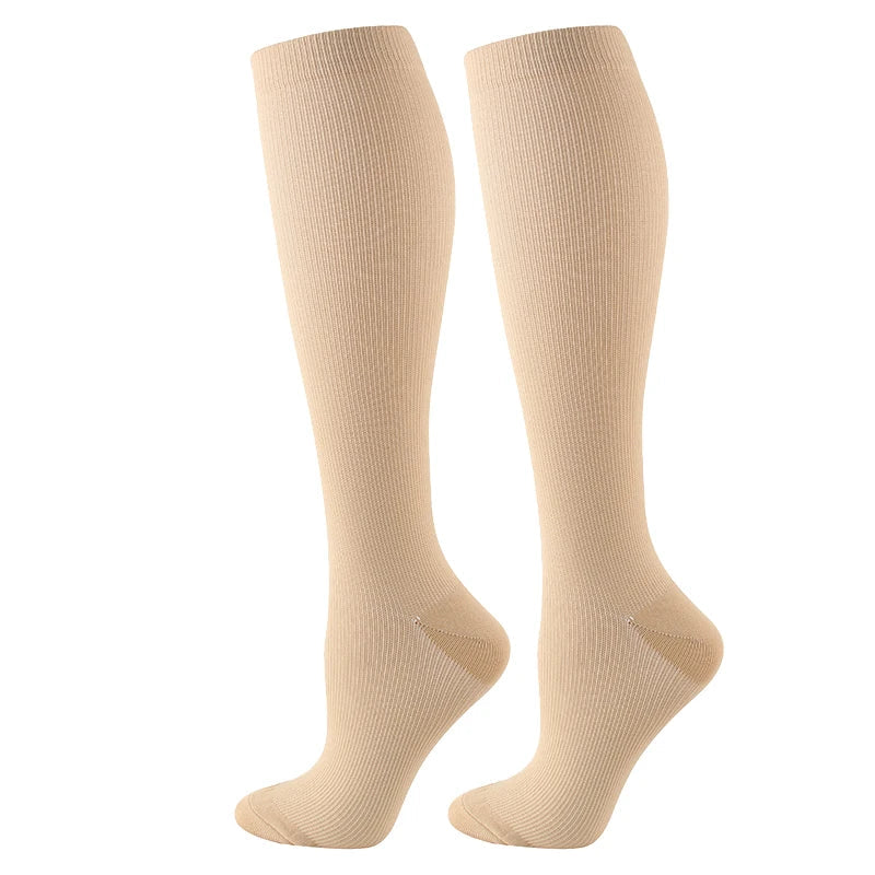Calze compressive unisex per migliorare la circolazione, ideali per sport, viaggio e ridurre la fatica.