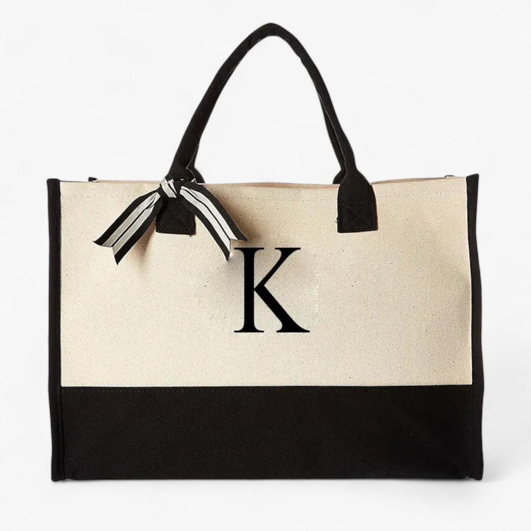 Elegante borsa tote donna, personalizzabile con iniziale. Beige e nero, grande, per un tocco di stile unico.