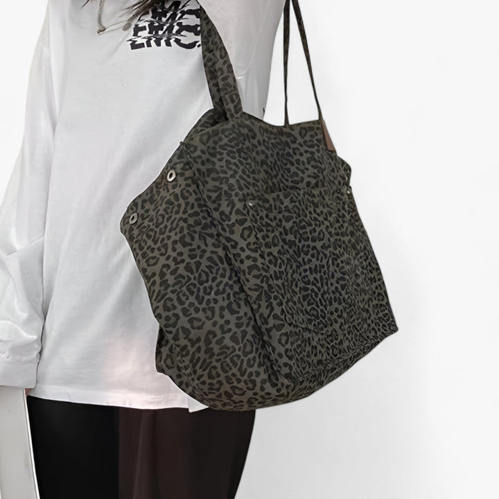 Moderna borsa tote donna con stampa leopardata, ampia e funzionale, ideale per accessori moda e quotidiano.