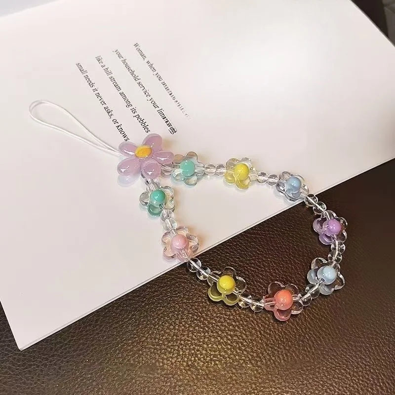 Accessorio moda donna, laccetto telefono con perline macaron colorate e fiore, comodità e stile al top.